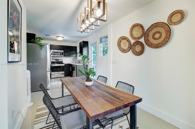 dining room featuring a notable chandelier