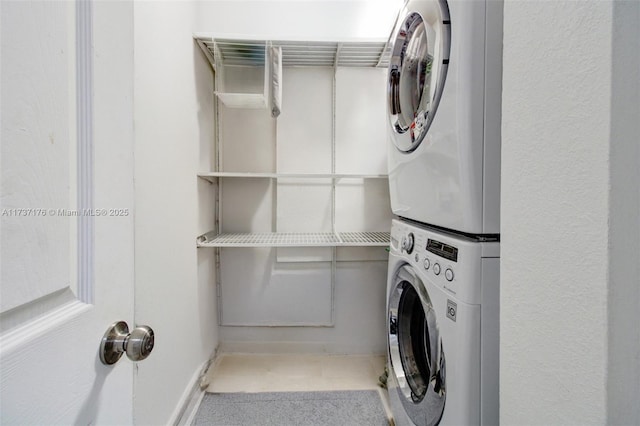 laundry area with stacked washer and dryer