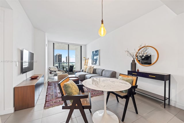 dining room featuring expansive windows and light tile patterned floors