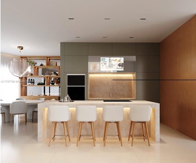 kitchen featuring pendant lighting, wooden walls, and a kitchen breakfast bar