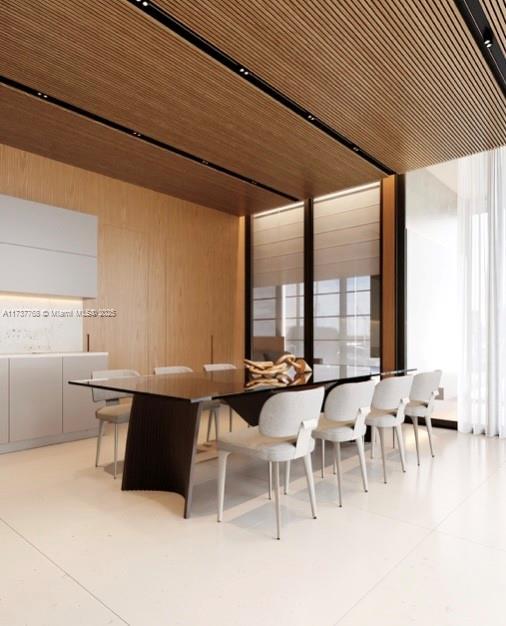 dining space with wood ceiling