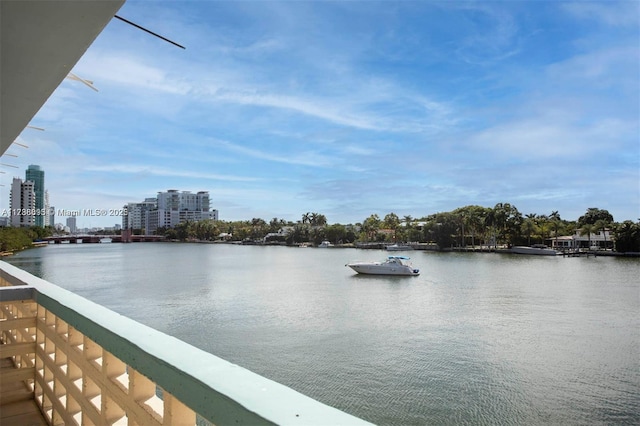 water view featuring a city view and a dock