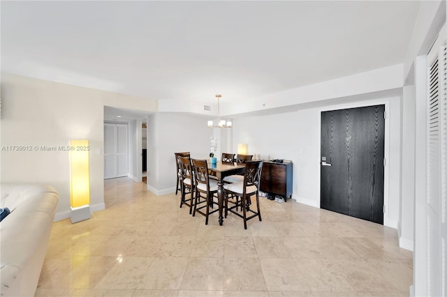 dining room with a chandelier