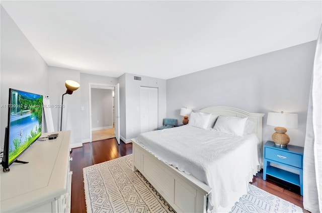 bedroom with hardwood / wood-style flooring and a closet