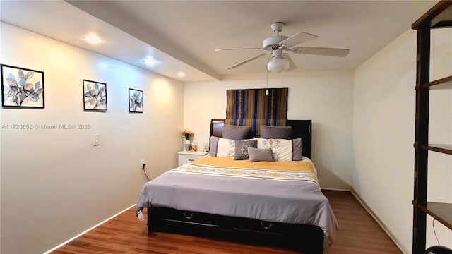 bedroom featuring hardwood / wood-style floors and ceiling fan