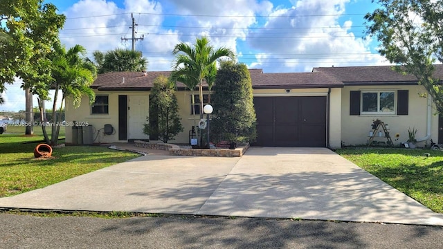 ranch-style house with a garage and a front lawn