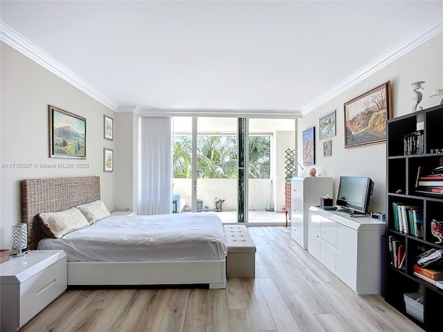 bedroom featuring access to exterior, crown molding, a wall of windows, and light wood-type flooring