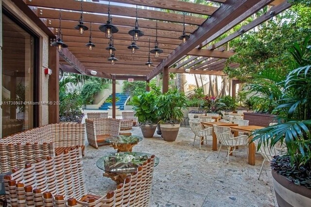 3400 SW 27th Ave Unit 302, Miami, FL 33133 - view of patio featuring a pergola