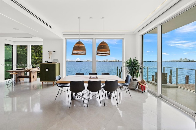 sunroom / solarium with a water view