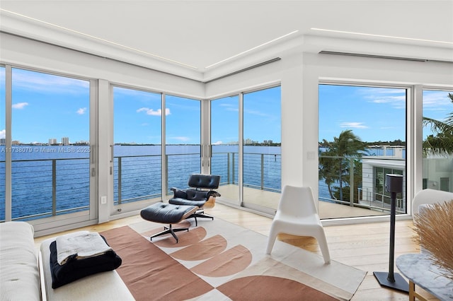 sunroom / solarium with a water view