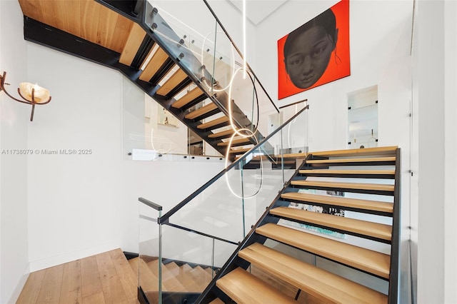 staircase featuring hardwood / wood-style flooring