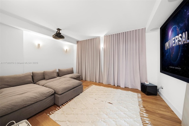 home theater room with hardwood / wood-style floors