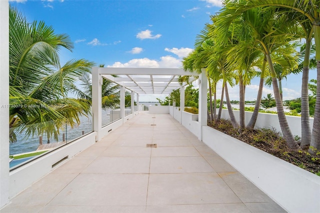 view of community featuring a pergola and a water view