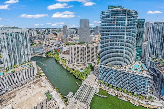 drone / aerial view featuring a water view and a city view