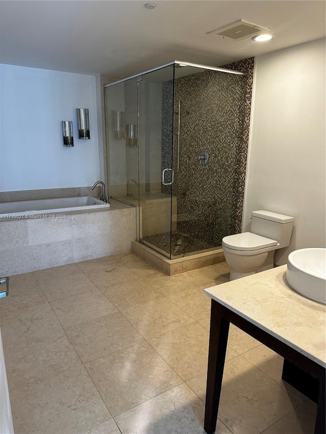 full bath with a stall shower, visible vents, toilet, a garden tub, and vanity