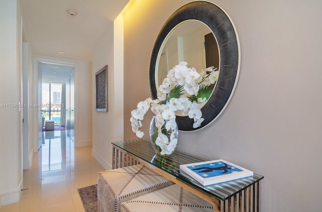 hallway featuring light tile patterned floors