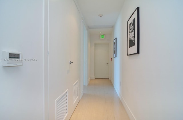 corridor with light tile patterned flooring