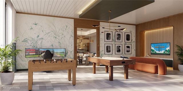 recreation room with crown molding and wood ceiling