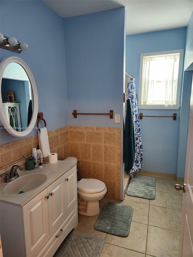 bathroom featuring tile walls, tile patterned flooring, vanity, toilet, and a shower with shower curtain