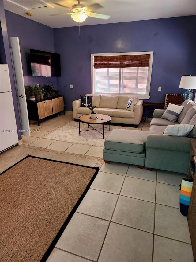 tiled living room featuring ceiling fan