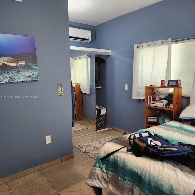 bedroom featuring a wall mounted air conditioner