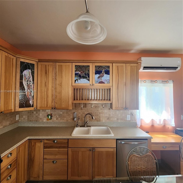 kitchen with brown cabinets, glass insert cabinets, a wall unit AC, and a sink