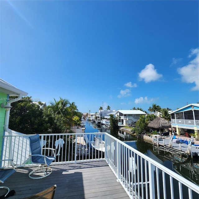 wooden deck with a water view