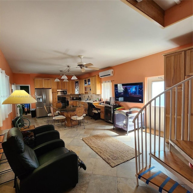 living room featuring ceiling fan, light tile patterned floors, sink, and an AC wall unit