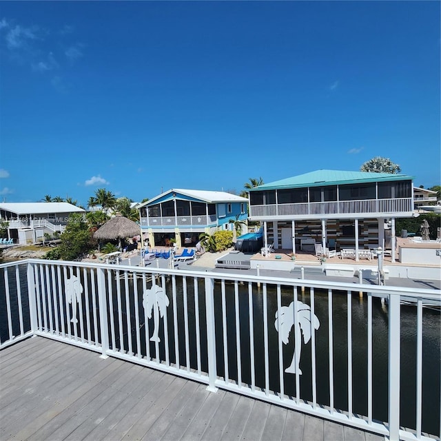 wooden terrace with a water view
