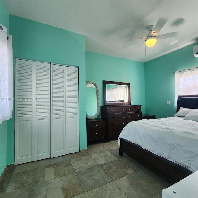 bedroom with stone finish floor and ceiling fan