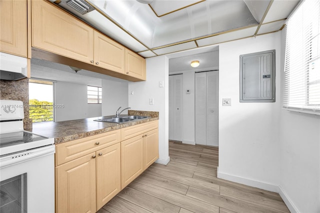 kitchen with electric stove, sink, electric panel, light hardwood / wood-style floors, and light brown cabinetry