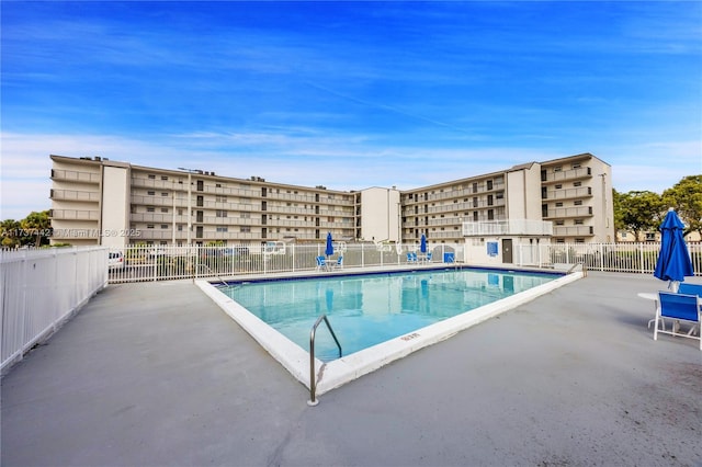 view of swimming pool featuring a patio