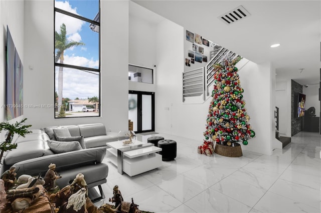 living room with a high ceiling