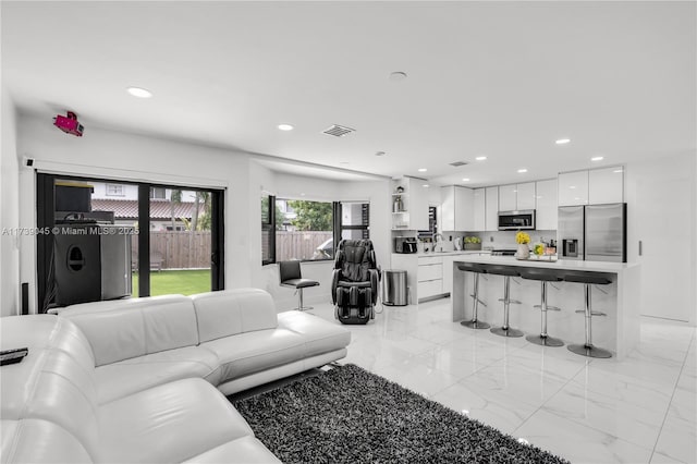 living room featuring washer / dryer