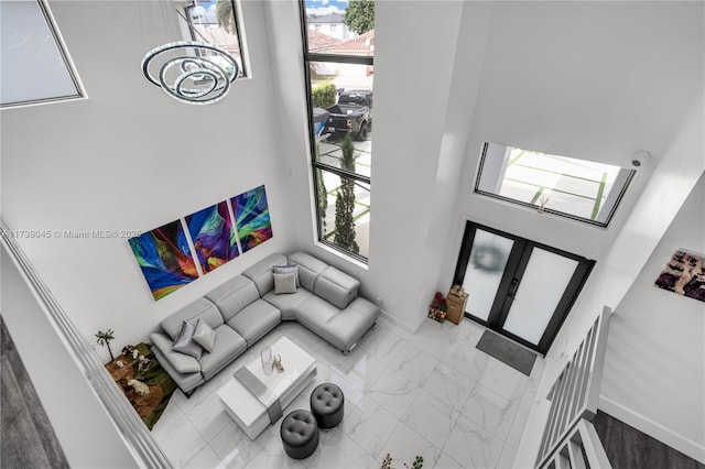 living room with french doors and a healthy amount of sunlight