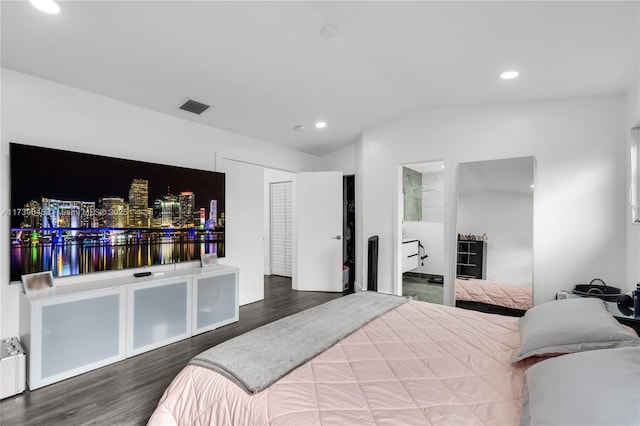 bedroom with hardwood / wood-style flooring and vaulted ceiling