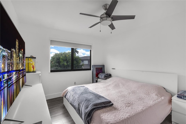 bedroom featuring ceiling fan and dark hardwood / wood-style floors