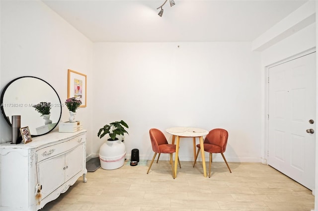 sitting room with light hardwood / wood-style flooring