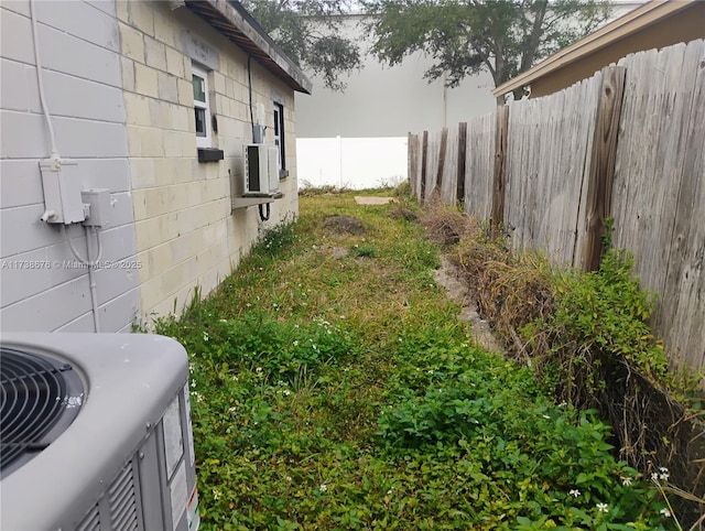 view of yard featuring central air condition unit