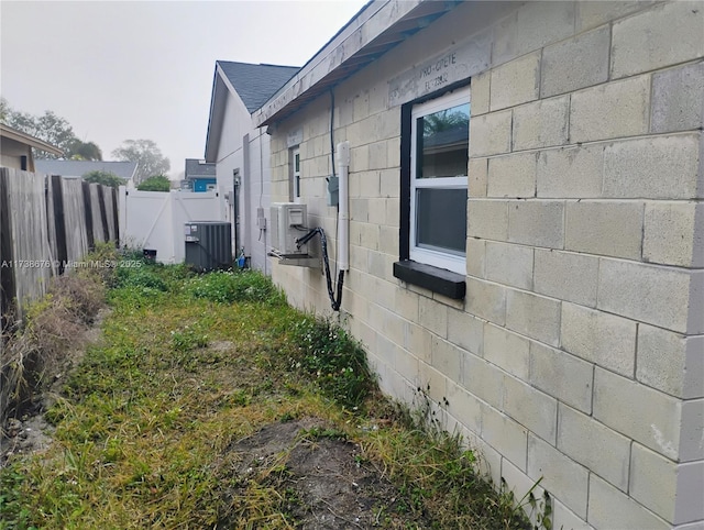 view of side of property with central AC unit