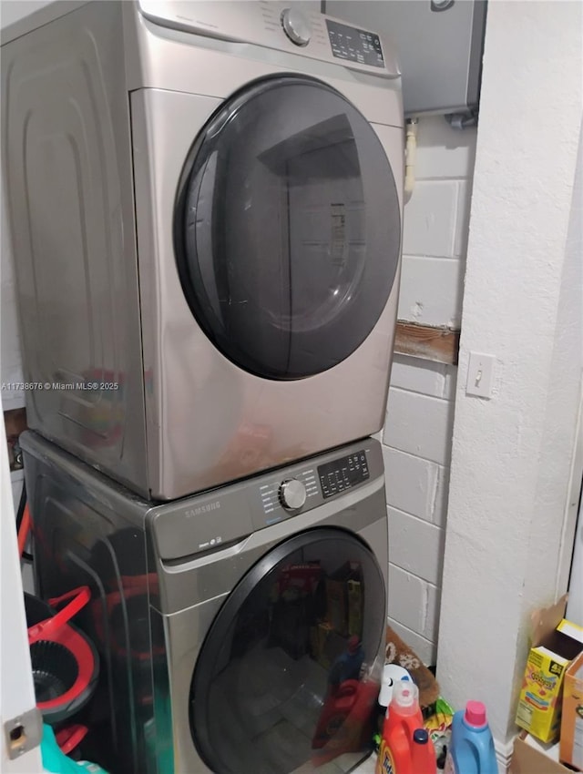 washroom with stacked washer and clothes dryer