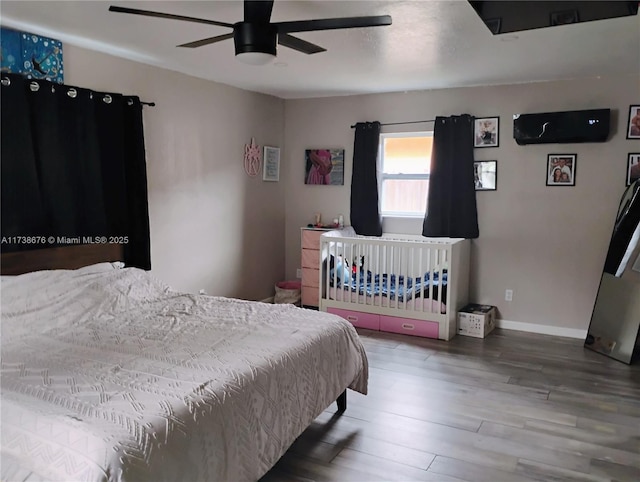 bedroom with hardwood / wood-style floors and ceiling fan