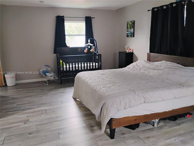 bedroom with wood-type flooring