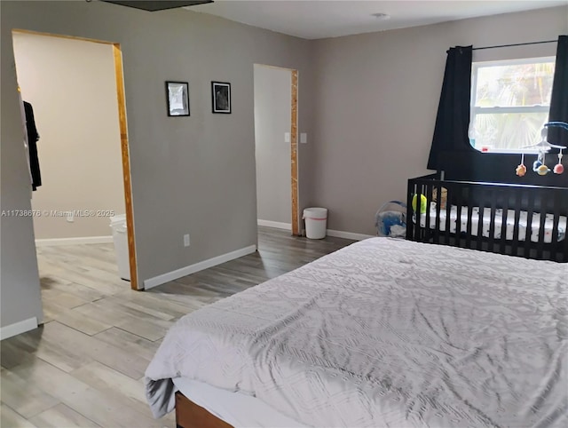 bedroom with wood-type flooring