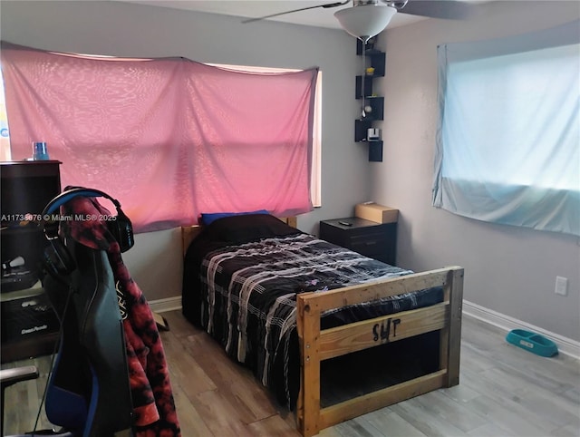 bedroom featuring ceiling fan and hardwood / wood-style floors