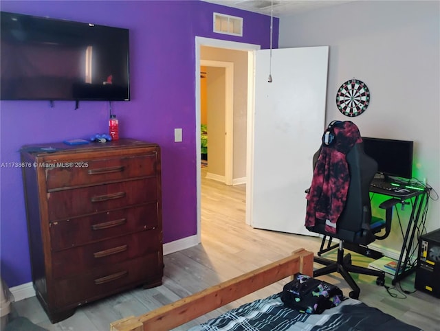 bedroom with light hardwood / wood-style flooring