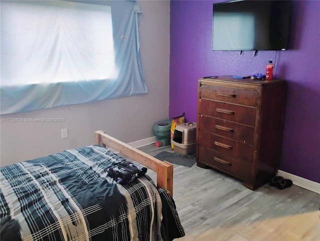 bedroom featuring light hardwood / wood-style floors