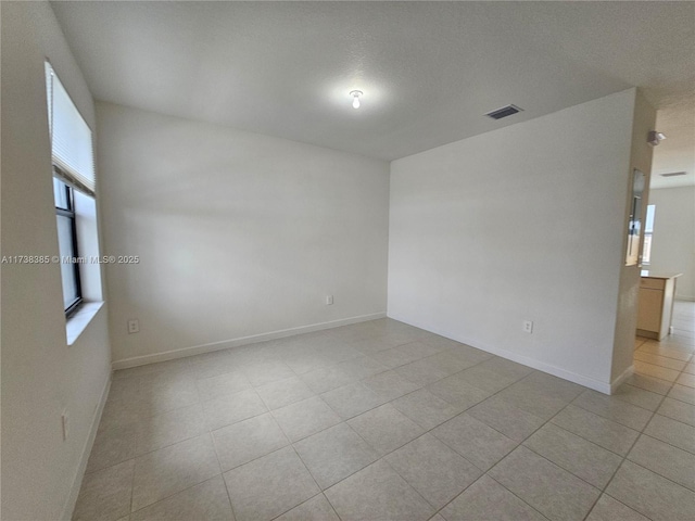 empty room featuring light tile patterned flooring