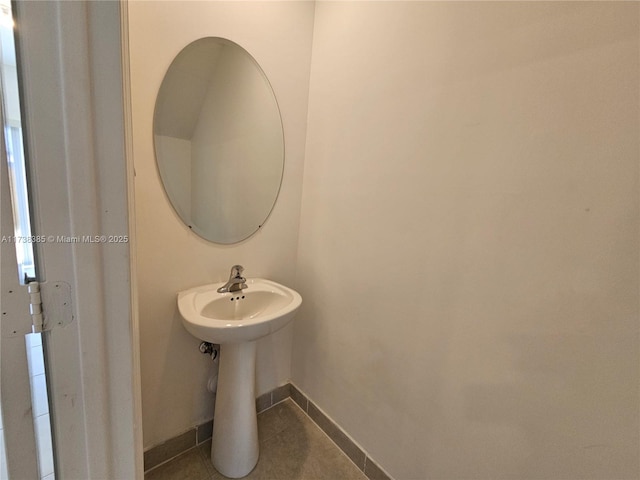 bathroom featuring tile patterned flooring and sink