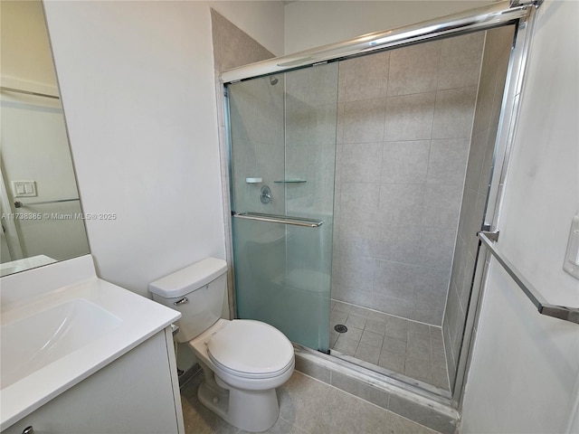 bathroom with vanity, an enclosed shower, and toilet